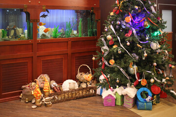 Christmas tree with gifts an aquarium with fish restaurant