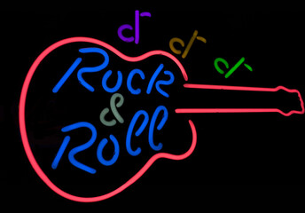 Colored neon sign with guitar and black background