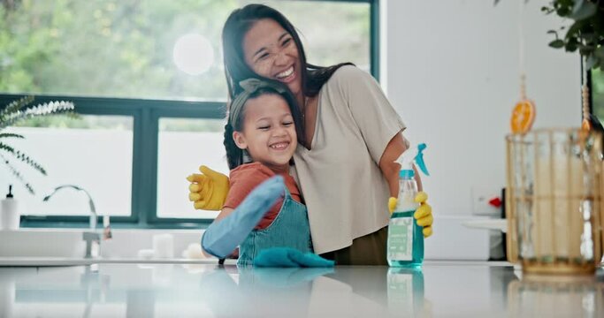 Mother, child and high five for cleaning in kitchen with embrace for teaching bacteria care, responsibility or bonding. Woman, daughter and gloves with hand gesture for washing dirt, germs or hygiene