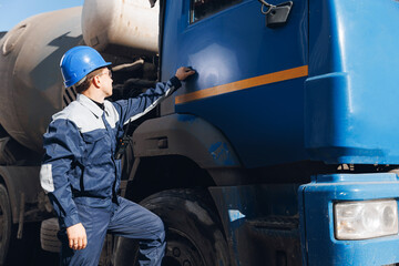 Engineer worker man driver of cement mixer truck