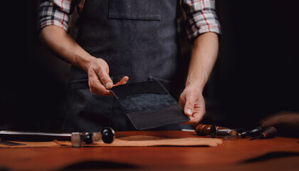 Tailor use tools for maker from natural leather product brown color in workshop. Concept shoemaker...