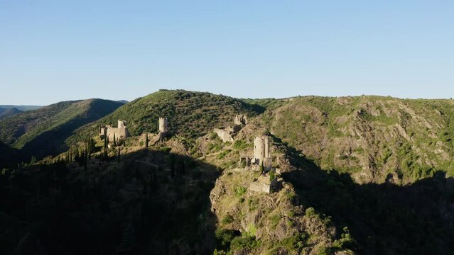 Aerial shot during the sunset of the four castles of Lastours in the south of France.