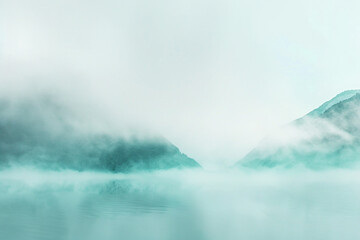Create a mottled background that reflects the serene beauty of a misty morning in a mountainous...