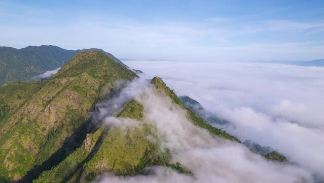 Aerial fly drone hyperlapse foggy or the clouds while sunrise sky, sea of fog mount nature.