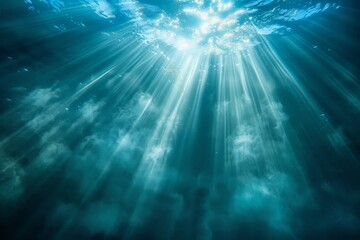 Obraz premium The suns rays penetrate the oceans surface, creating a dazzling effect as they illuminate the water below. The light refracts and dances, highlighting the depths of the sea.