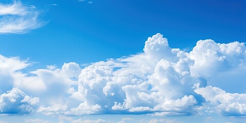 Beautiful blue sky and white cumulus clouds abstract background. Cloudscape background. Blue sky and fluffy white clouds on sunny days. Blue sky and daylight.