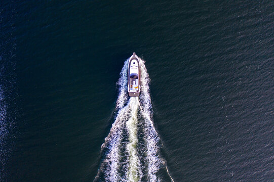 Yacht at sea full speed from above