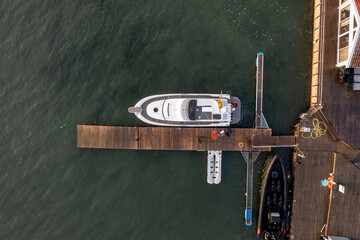 Fishing boat anchored at the harbor from above