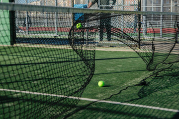 padel or tennis ball moving the net