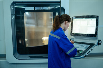 Female Robotics engineers Using Controller to Remotely Operate programming and Manipulating Robot