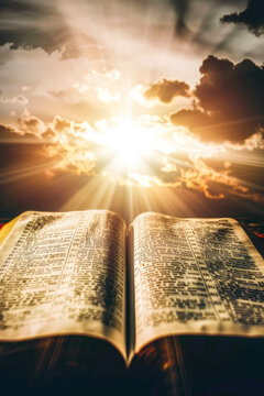 An inspiring image of an open bible with mountainous sunrise in the background, illustrating new beginnings