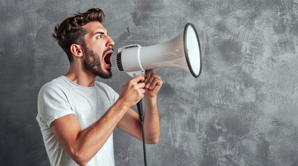 Man does announcement using a megaphone on a gray background, symbolizing effective communication and powerful announcements