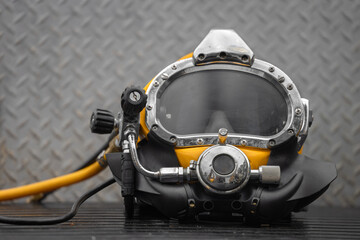 Commercial diving helmet closeup photo with steel background - 751706553