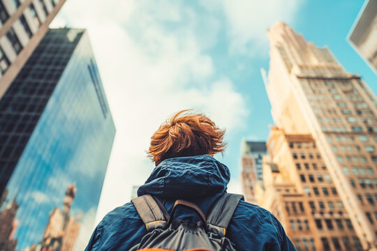 Man vlogging in the city. Blue sky. He explores new places and uploads content to social networks.