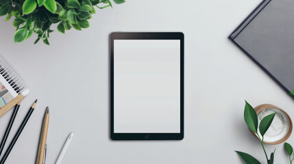 Modern Tablet Mock-up on a Clean, Minimalist Workspace with Creative Supplies and Green Plants, Perfect for App Display or Design Presentation.