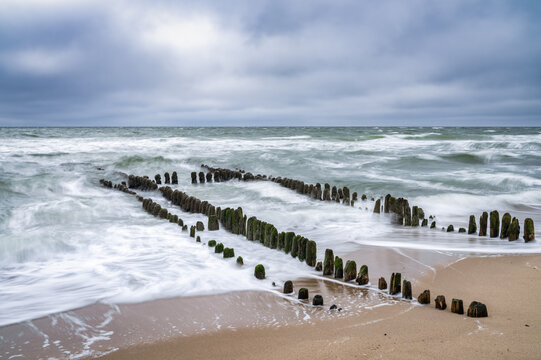 Wooden groyne at the North Sea coast near Rantum, Sylt, Schleswig-Holstein, Germany