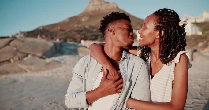 Love, beach and black couple hug and kiss for bonding, relax and relationship in nature. Dating, travel and happy African man and woman by ocean for romantic holiday, vacation and weekend together