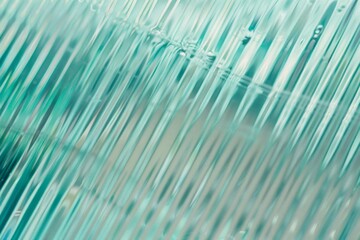 Abstract wave glass vertical line pattern background. Texture of wavy glass illuminated with light.