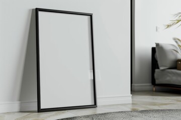 Empty thin black frame on light wooden floor with white wall behind it. Empty poster fram