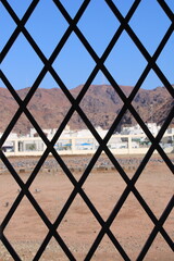 Cemetery behind metal fence. sayyid al shuhada. medina saudi arabia