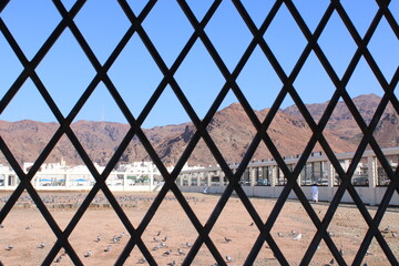 Cemetery behind metal fence. sayyid al shuhada. medina saudi arabia
