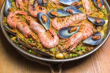 Brightly colored seafood paella presented in a traditional pan, typical Spanish cuisine, Majorca, Balearic Islands, Spain