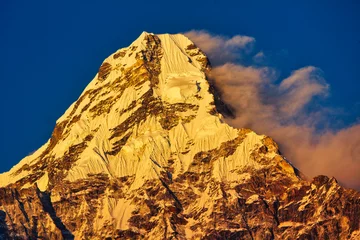 Papier Peint photo autocollant Ama Dablam Ama Dablam shining like burnished gold in the golden light of the evening seen from Pangboche in Nepal