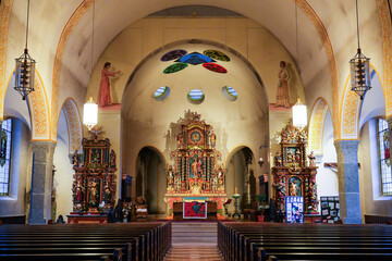 Fototapeta premium Central aisle of the Pfarrkirche (parish church) of St. Mauritius in the village of Zermatt in the Swiss Alps, Canton of Valais - Religious building in Switzerland