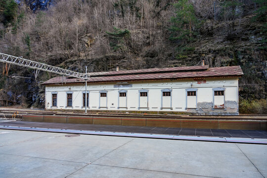 Train station of Iselle di Trasquera of the car shuttle train of the Simplon Tunnel in the Alps connecting Brig in Switzerland with Italy. Car-carrying train traversing the Lepontine Alps