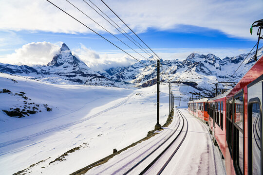 View of the Matterhorn from a window of the cogwheel train of the Gornergrat Railway descending towards Zermatt in the Swiss Alps in winter, Canton of Valais, Switzerland