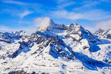 Ober Gabelhorn summit towering above the ski slopes of the Zermatt winter sports resort in the...