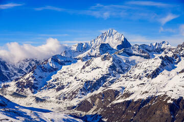 Dent Blanche summit towering above the ski slopes of the Zermatt winter sports resort in the Swiss Alps, Canton of Valais, Switzerland