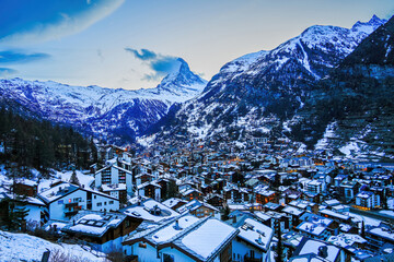 Aerial view of the village of Zermatt overlooked by the Matterhorn peak in the Swiss Alps in winter...