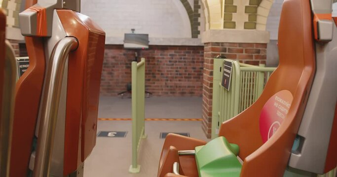 chairs on a rollercoaster trailer. rollercoaster rails. Bright orange armchairs.