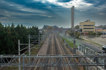 railway track, factory in the background, wonderful sky