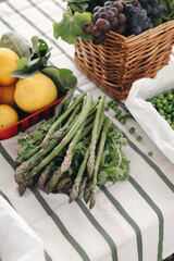Fresh Asparagus and Fruit on Striped Tablecloth