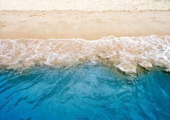 Blue ocean wave or clear sea with sandy beach, summer concept background - 751764947