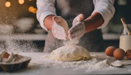 Keuken spatwand met foto close up hands of a chef clapping hands and preparing yeast dough for pizza pasta in white flour filesr in background of modern restaurant cooking concept of food and cook © Kendrick