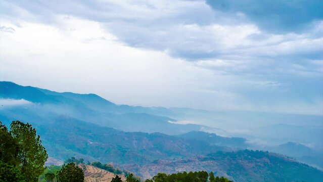 4K Timelapse video of Beautiful Green Mountains and valleys of Lansdowne in the district of Garhwal, Uttarakhand. Lansdown Beautiful Hills. The beauty of nature on the hills of Uttrakhand.
