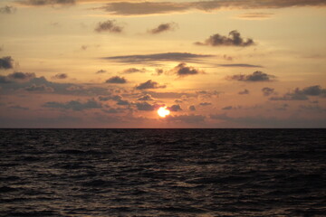 sunset at sea with clouds