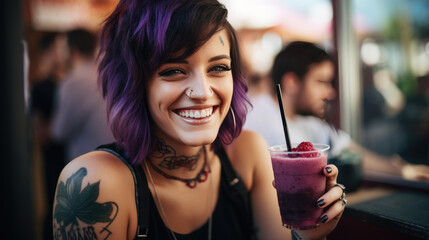 Smiling woman with tattoos, holding a smoothie - obrazy, fototapety, plakaty