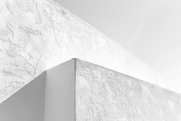 Admire the sleekness of a pure white stucco wall, embodying the essence of minimalistic design