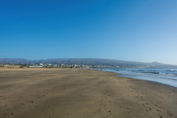 Sandy beach of Maspalomas with a view of the city on Gran Canaria, Spain