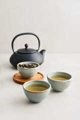 two ceramic cups of green tea