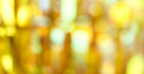 Golden color blurred abstract background, Christmas and New Year golden background