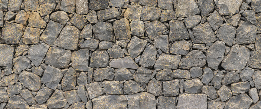 Textura panor&aacute;mica de muro de piedra volc&aacute;nica natural de Tenerife, Espa&ntilde;a	