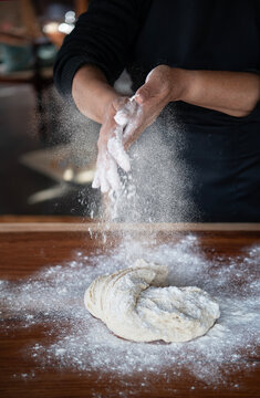 Baker kneading dough