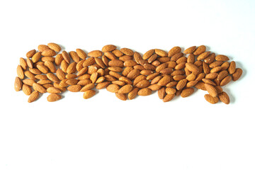 A pile of almonds isolated on a white background,flat lay,copy space