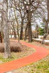 a red running track in the park.