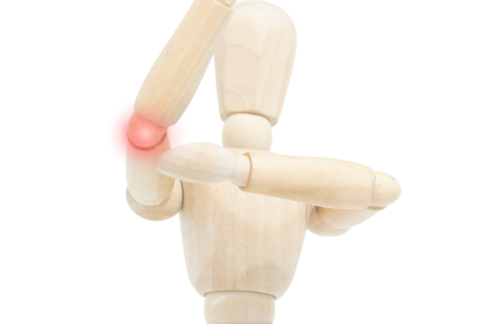 A wooden mannequin pointing to an elbow pain with a red dot. Concept of pain. Lateral or medial epicondylitis. Cubital tunnel syndrome.